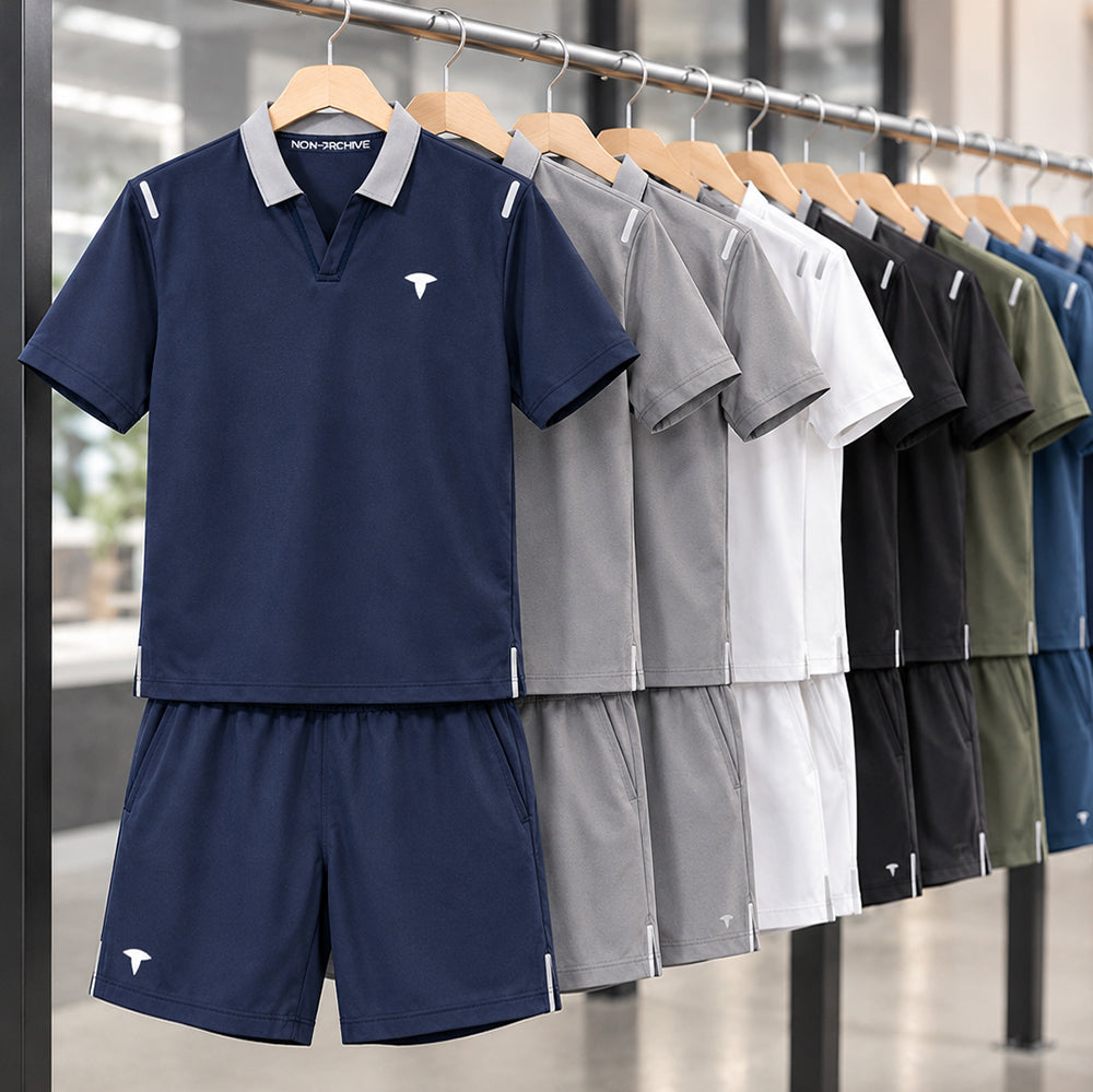 Showroom display of custom summer T‑shirt and shorts sets neatly arranged on a clothing rack for OEM production